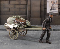 Evacuee pulling cart